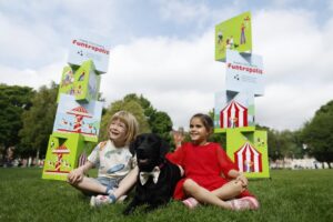 Labrador with two small children